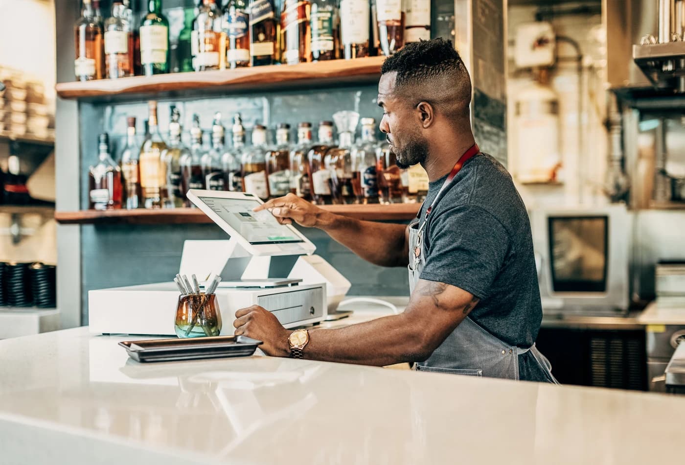 Clover Station Solo behind a busy bar counter