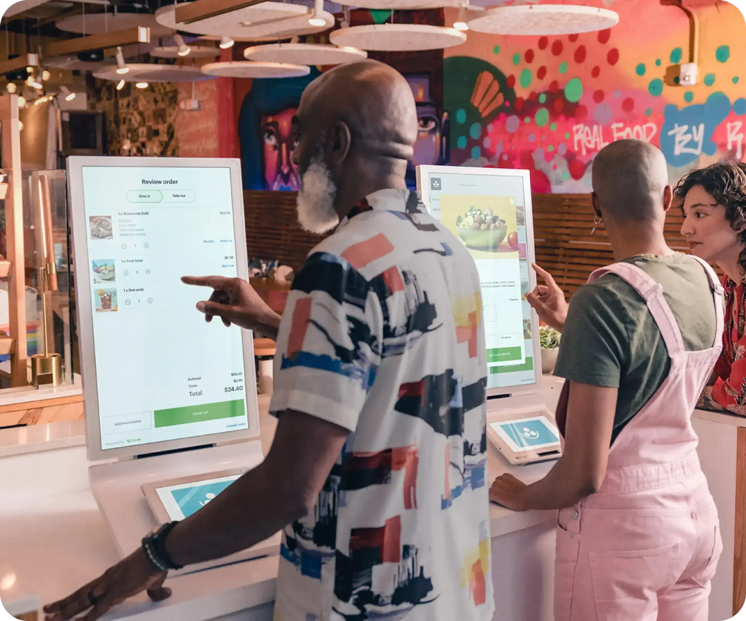 Guest using a Clover self-ordering kiosk